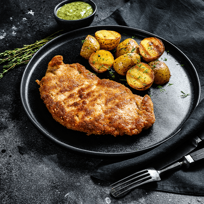 Chilli & thyme chicken schnitzel with roasted baby potatoes