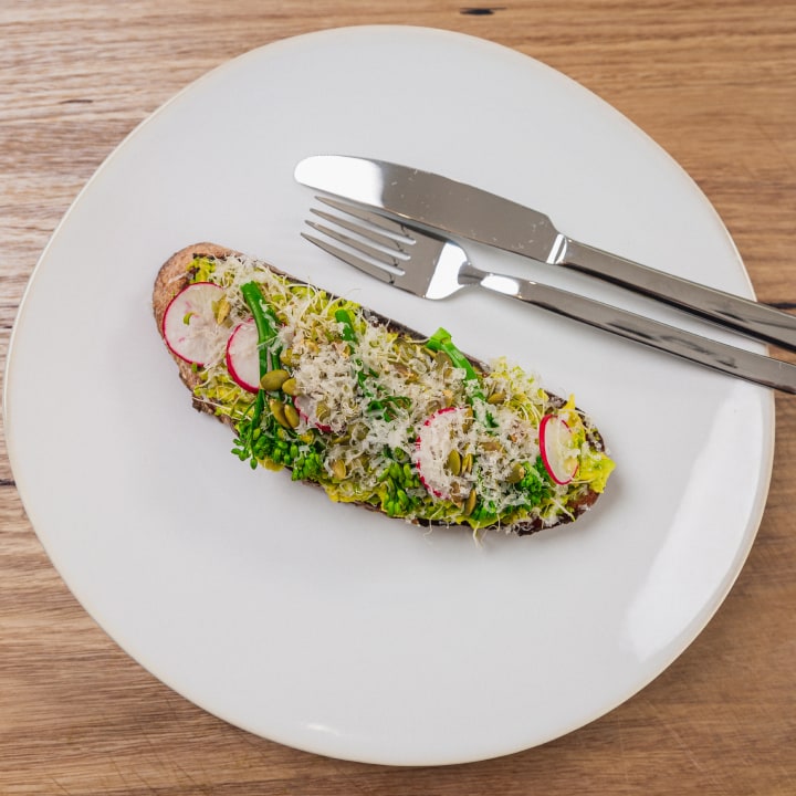 Avocado toast with radish & purple sprouting broccoli